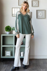Full body front view of the 7th Ray Color Block V-Neck Knit Top styled with white jeans and boots, showcasing its relaxed fit and boho details.