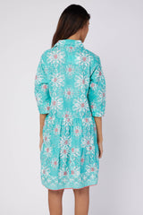 Back view of the Alcee Blue and White Resort Shirt Dress by ModaPosa, showing the flowing cotton fabric and intricate majolica motif.