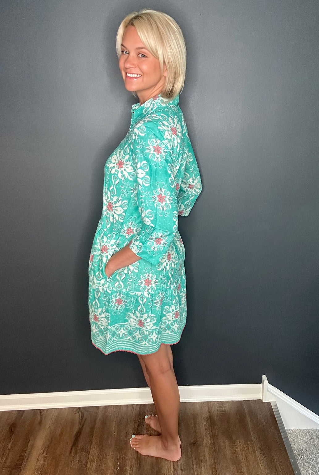 Side view of the Alcee Blue and White Resort Shirt Dress by ModaPosa, highlighting the lightweight cotton fabric, side pockets, and elegant silhouette.