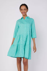 Model wearing the Moda Posa Alcee Turquoise Shirt Dress in a studio setting, featuring a collared neckline, three-quarter sleeves, and relaxed tiered fit.