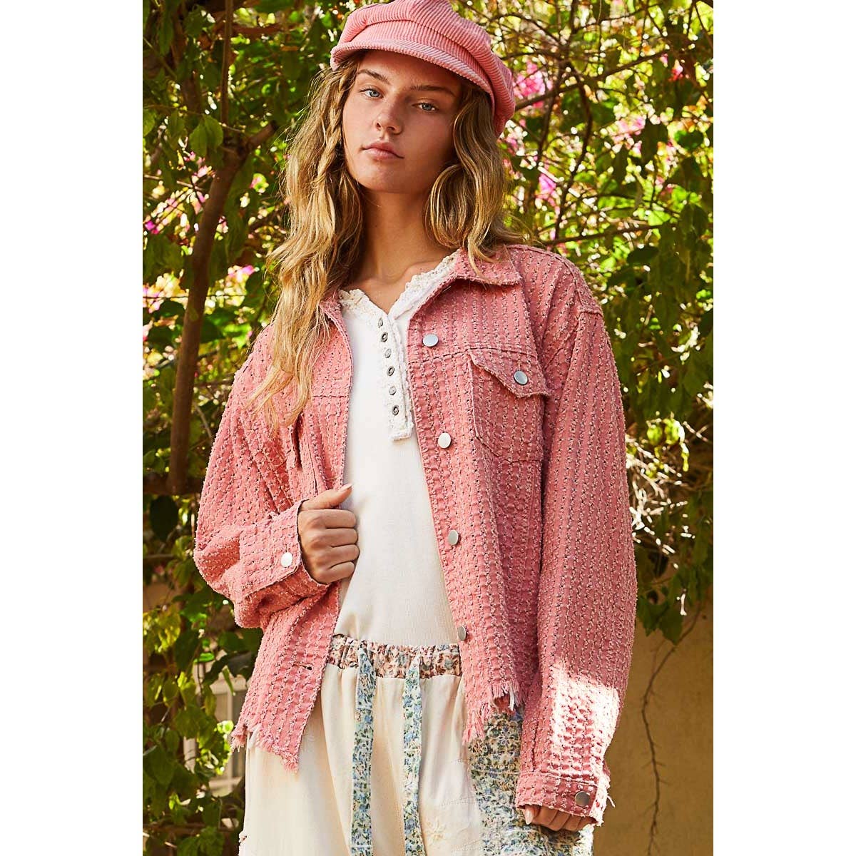 Model wearing the Pol Clothing Vintage Washed Textured Twill Jacket in a relaxed fit, buttoned up over a boho-style white top with floral pants.