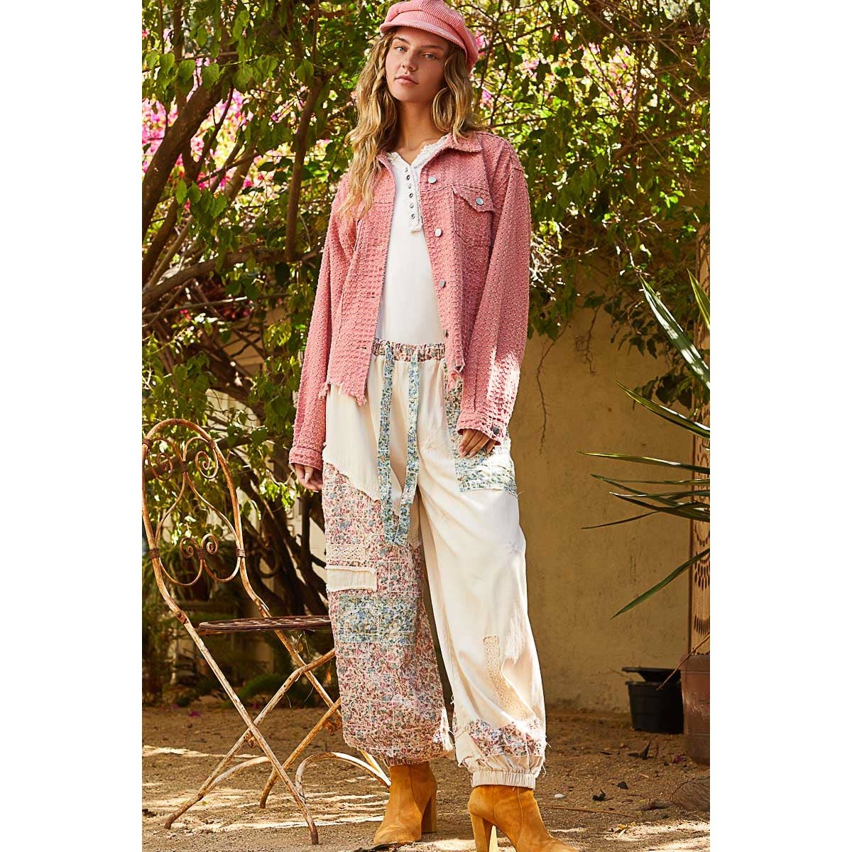 Model wearing the Pol Clothing Vintage Washed Textured Twill Jacket styled with a white top, floral patchwork pants, and tan boots, showcasing a boho aesthetic.