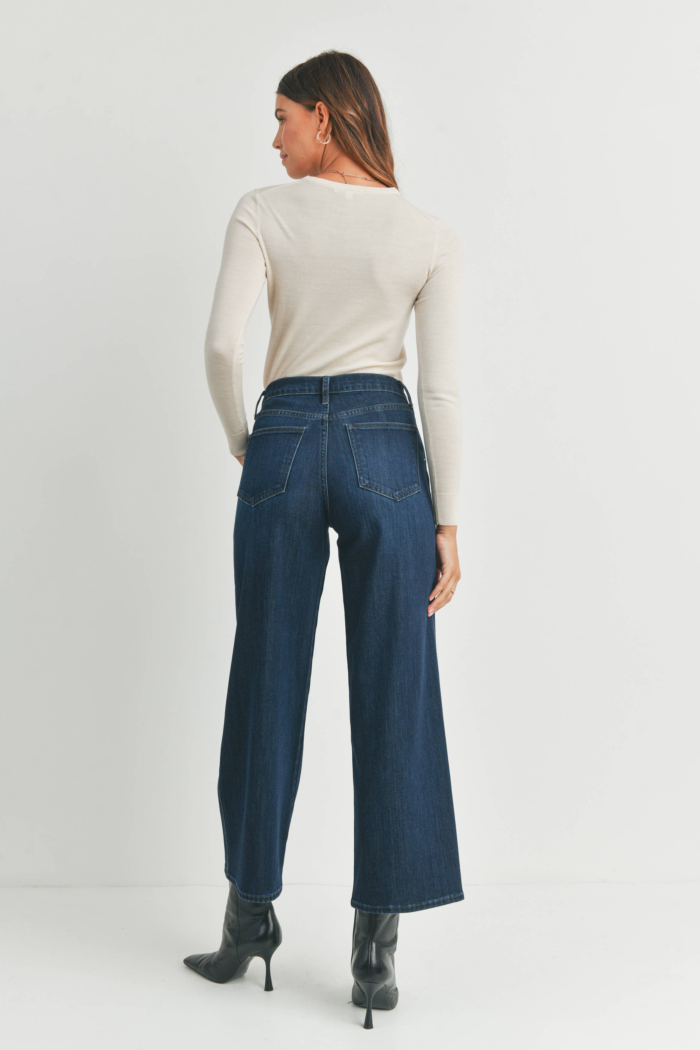 Back view of the DK Seamed Utility Straight Jeans by Just Black Denim showing back pockets and high-rise fit.
