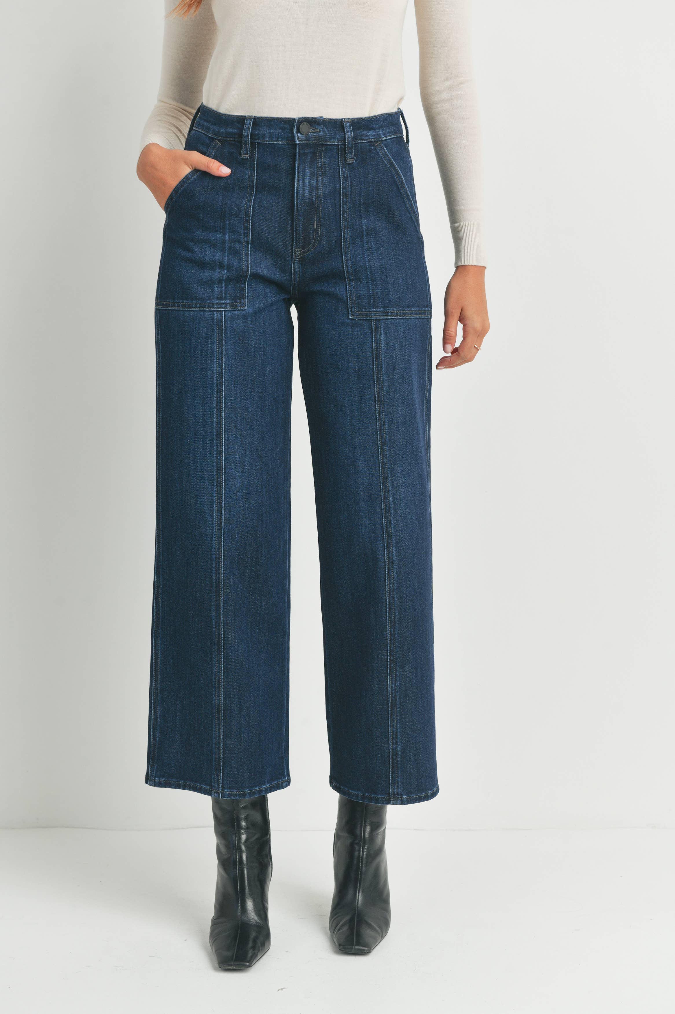 Closeup view of the DK Seamed Utility Straight Jeans by Just Black Denim in dark denim with utility seams.