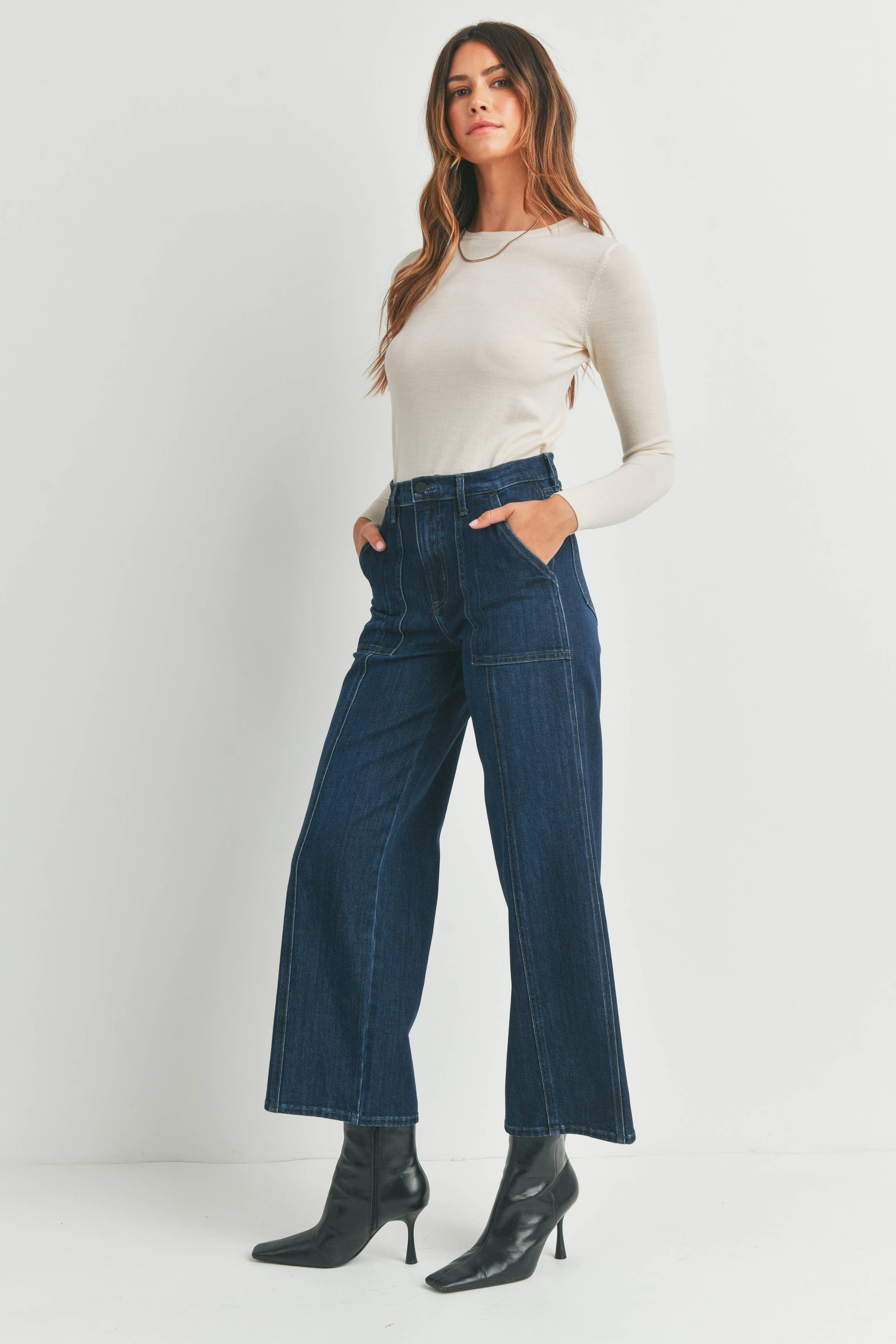 Side view of the DK Seamed Utility Straight Jeans by Just Black Denim, styled with a simple white top.