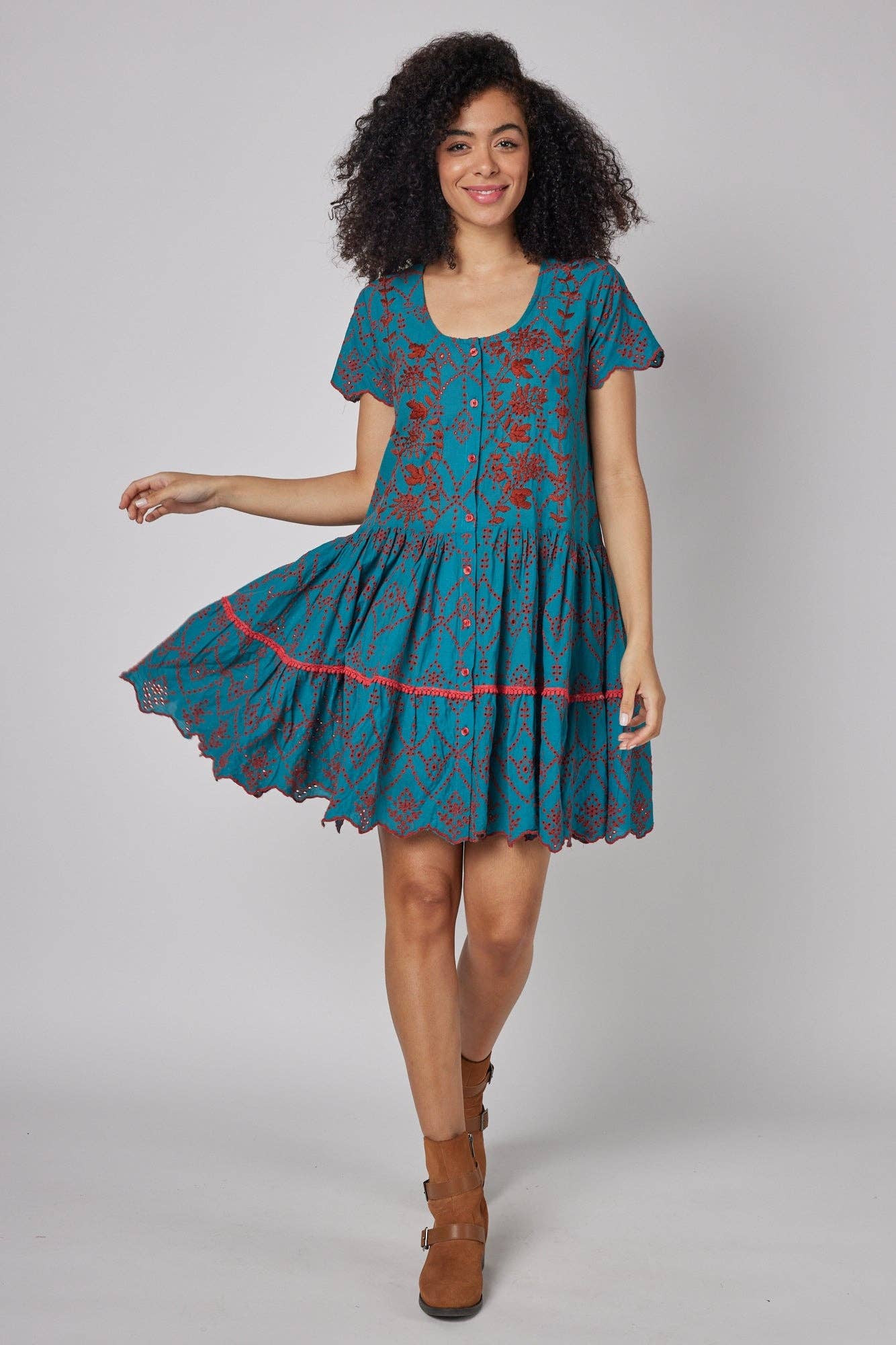 Model twirling in the MODAPOSA Simonetta Hand Embroidered Fall Dress, highlighting its breezy fabric, intricate embroidery, and flattering A-line silhouette.