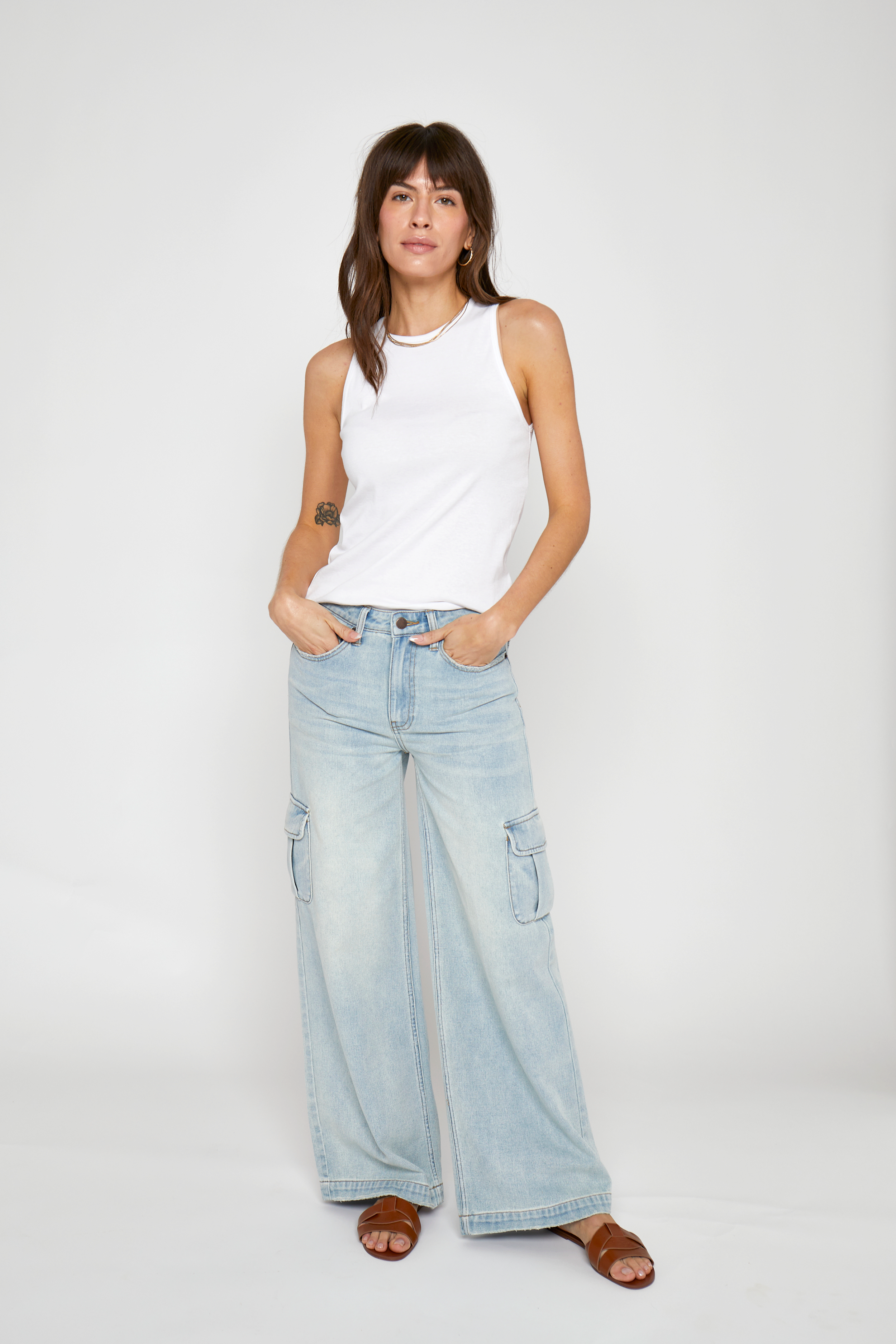 Front view of the Madison Cargo Wide Leg Mid Rise Jeans by Oliver Logan in Hotel California, designed with a mid-rise waist, cargo pockets, relaxed fit, and crafted from sustainable denim.