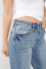 Up-close view of the Madison Wide Leg Mid Rise Jeans by Oliver Logan in Highway 66, designed with a mid-rise waist, relaxed fit, and crafted from sustainable denim. Showing stitching, pocket, and details up close. 