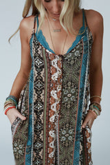 Close-up of Three Bird Nest Hanging Gardens Jumpsuit showing detailed boho print and button front.