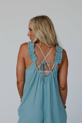 Back close-up view of the Three Bird Nest Seraphina Jumpsuit in Sea Foam, featuring an open back with tie detail and relaxed boho feel.