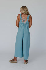 Back view of the Three Bird Nest Seraphina Jumpsuit in Sea Foam, featuring an open back with tie detail and relaxed boho feel.