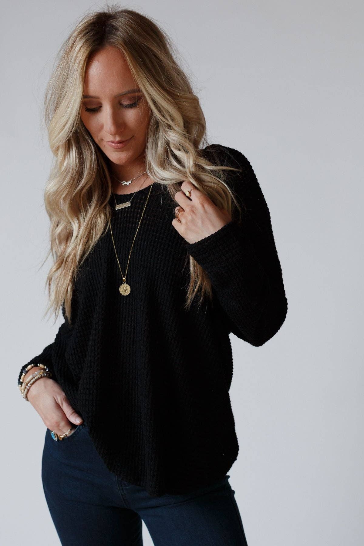 Front view of the Flattering Open Back Thermal Knit Top by Three Bird Nest in black with a relaxed V-neckline.