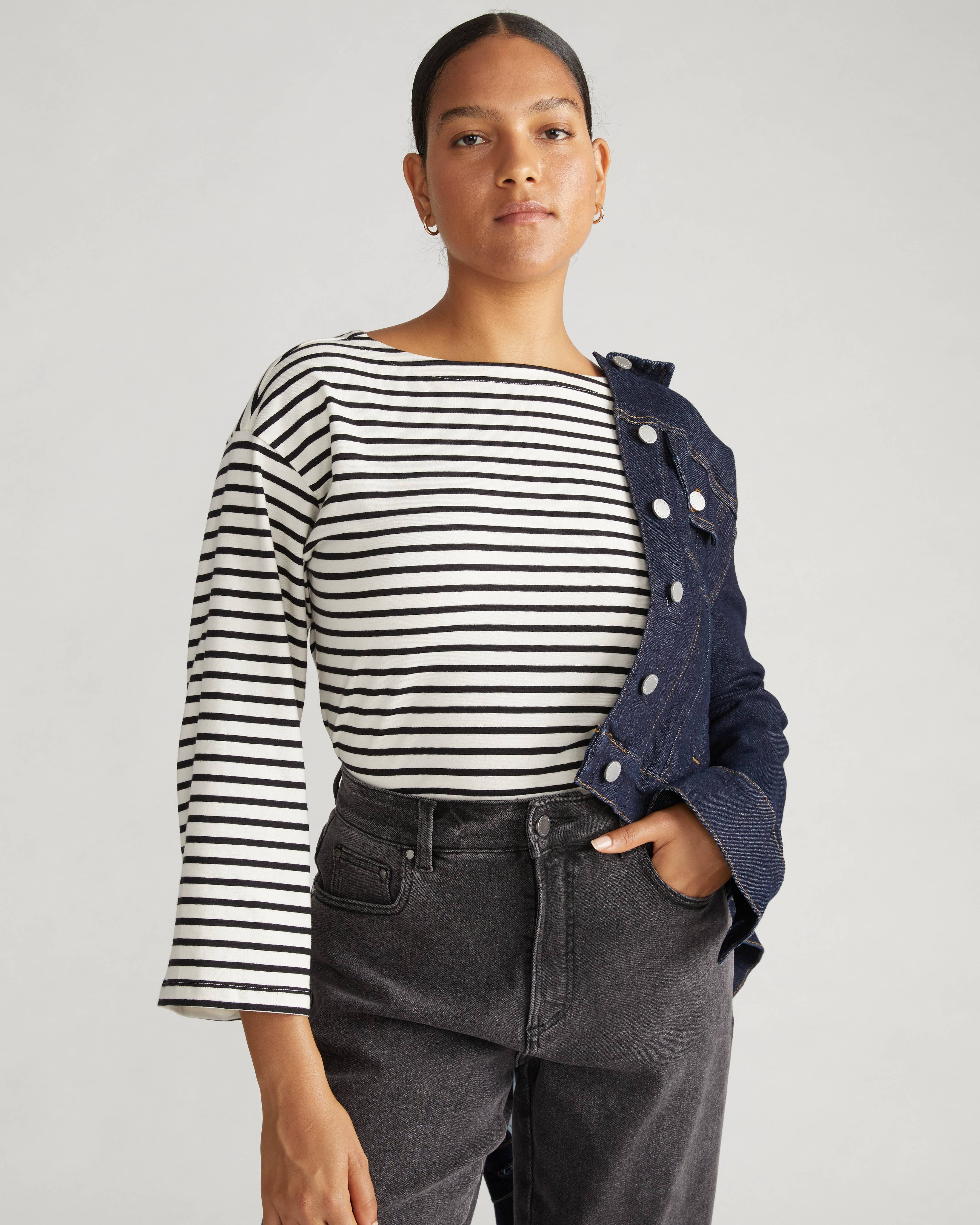Front view of the Universal Standard Montauk Breton Stripe Bell Sleeve Top in ecru and black stripe, featuring a boat neckline and relaxed fit in plus size.